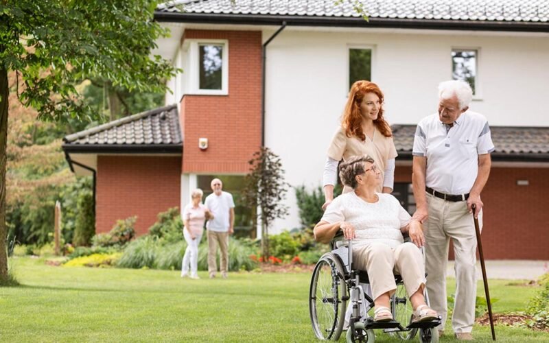 an,elderly,woman,on,a,wheelchair,and,her,husband,with