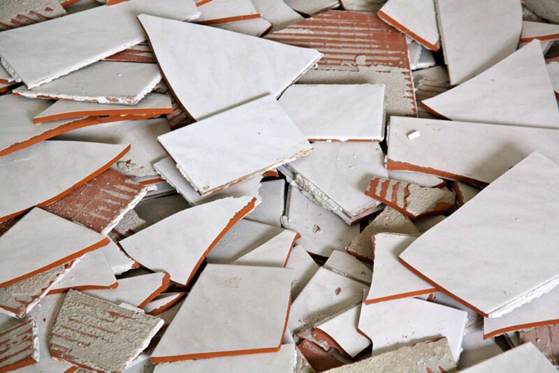 what to do first when you notice a broken tiled surface